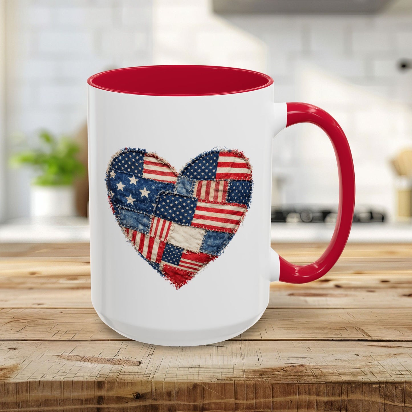 15oz white ceramic mug with a red handle and interior, featuring a stitched American flag patchwork heart design.