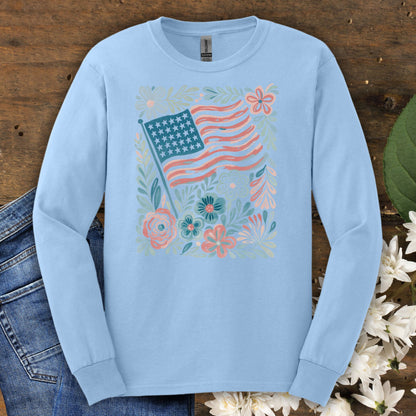 Light blue long sleeve tee with a vintage-style American flag and hand-drawn flowers.