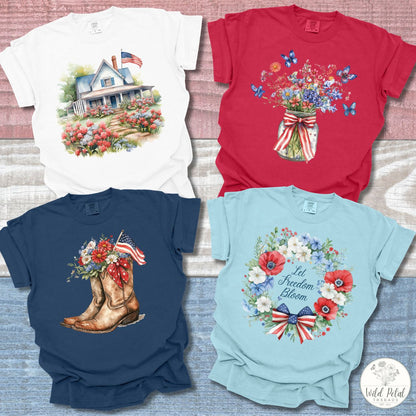 Four patriotic farmhouse and floral graphic tees: white, red, navy, and light blue, featuring American flags.