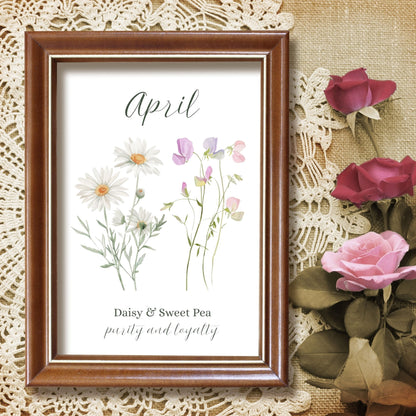 April birth month flower art print in a brown frame, featuring daisies and sweet peas.