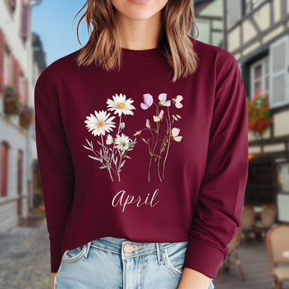 Burgundy long-sleeve tee with hand-drawn daisies and sweet peas, and "April" script.