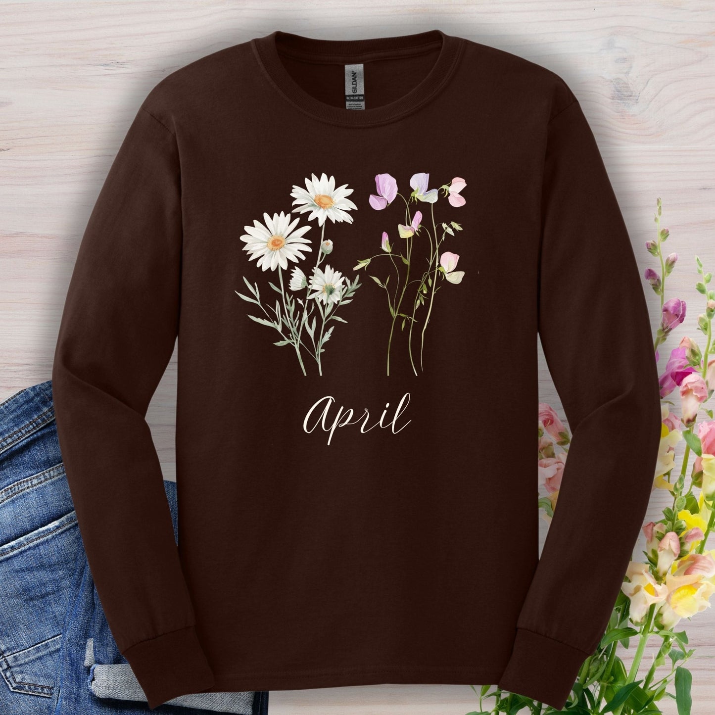Dark chocolate long sleeve tee with hand-drawn daisy and sweet pea flowers and "April" script.
