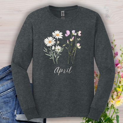 Dark Heather long-sleeve tee with hand-drawn daisy and sweet pea flowers, "April" script, and ribbed collar.