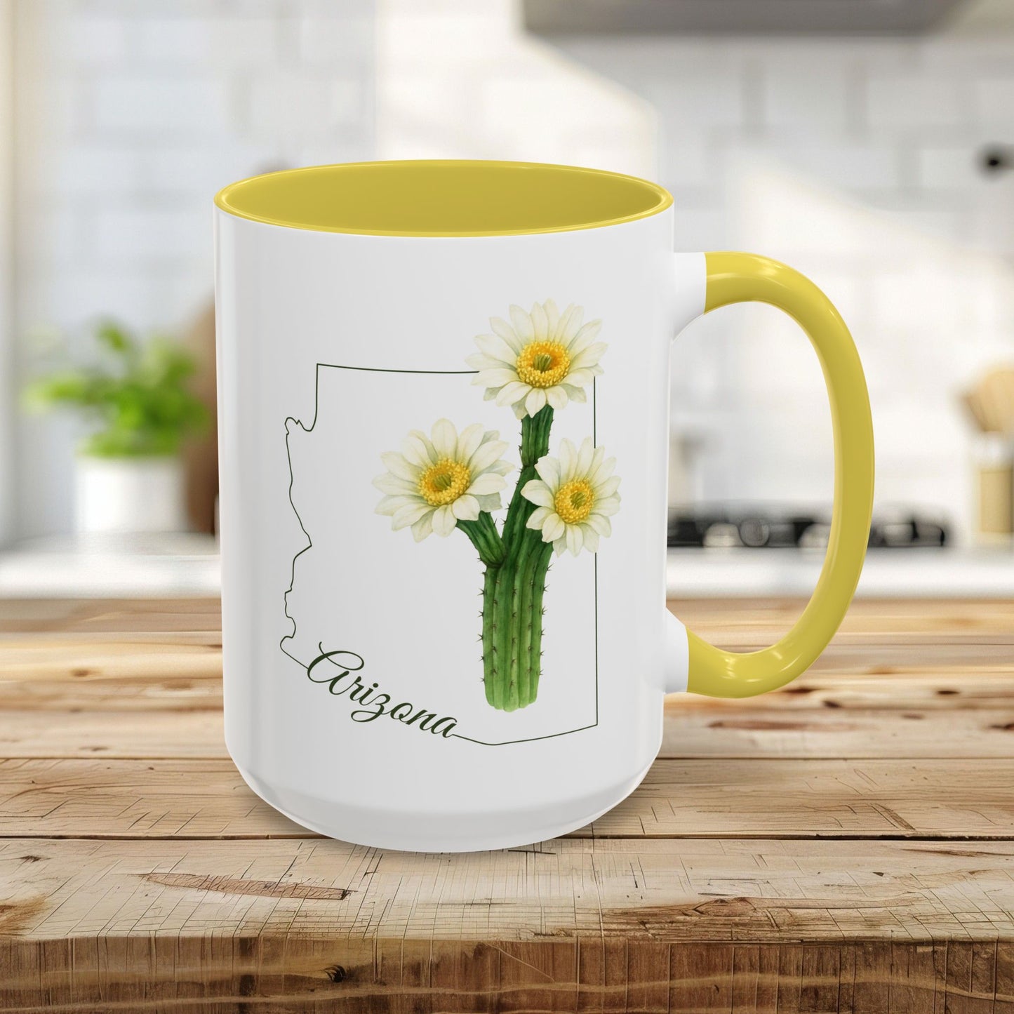 15oz white ceramic mug with yellow handle/interior, featuring an Arizona map outline and blooming saguaro cactus.