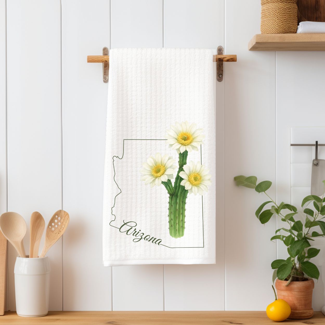 White microfiber tea towel with a saguaro cactus bloom, Arizona outline, and "Arizona" script.