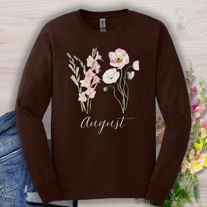 Dark chocolate long-sleeve tee with watercolor gladiolus and poppy flowers, "August" script.