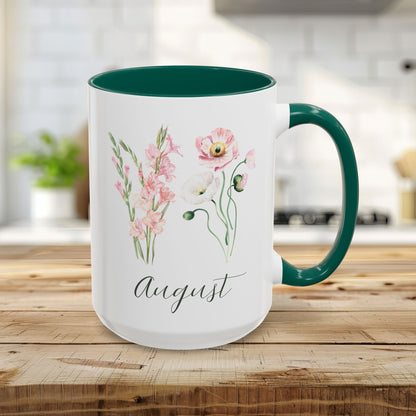 15oz white ceramic mug with green handle/interior, featuring watercolor gladiolus and poppy blooms, "August" script.