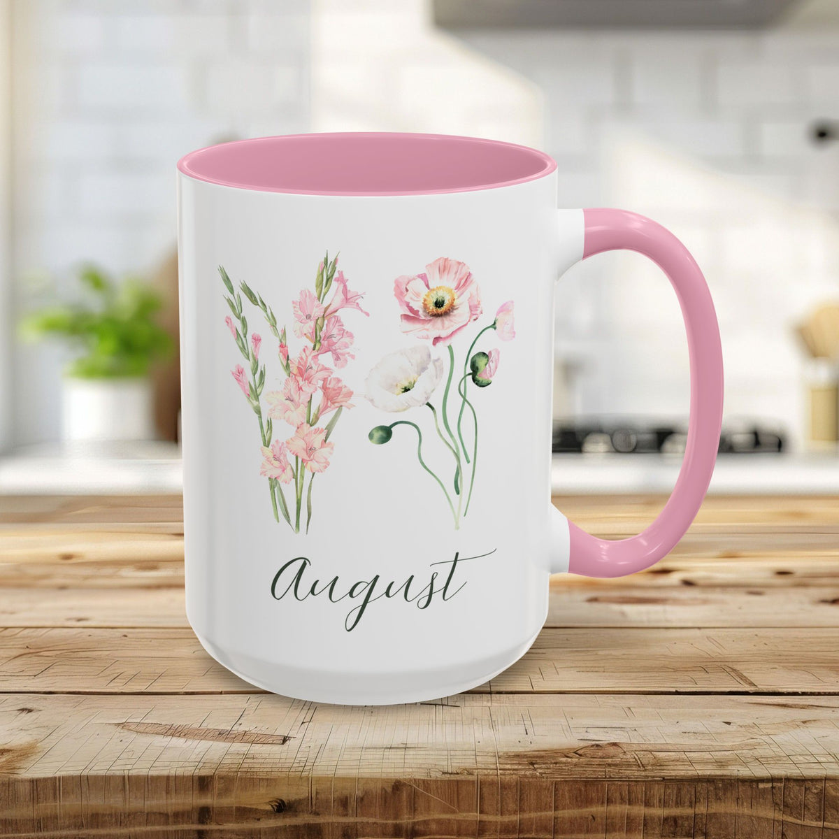15oz white ceramic mug with pink handle/interior, featuring watercolor gladiolus, poppy blooms, and "August" text.