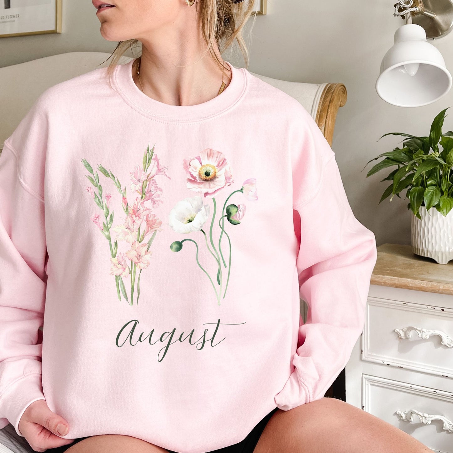 Pink August birth month flower sweatshirt with watercolor gladiolus and poppy blooms.