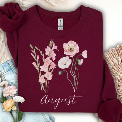 Maroon cotton-poly sweatshirt with watercolor gladiolus and poppy flowers, plus "August" text.