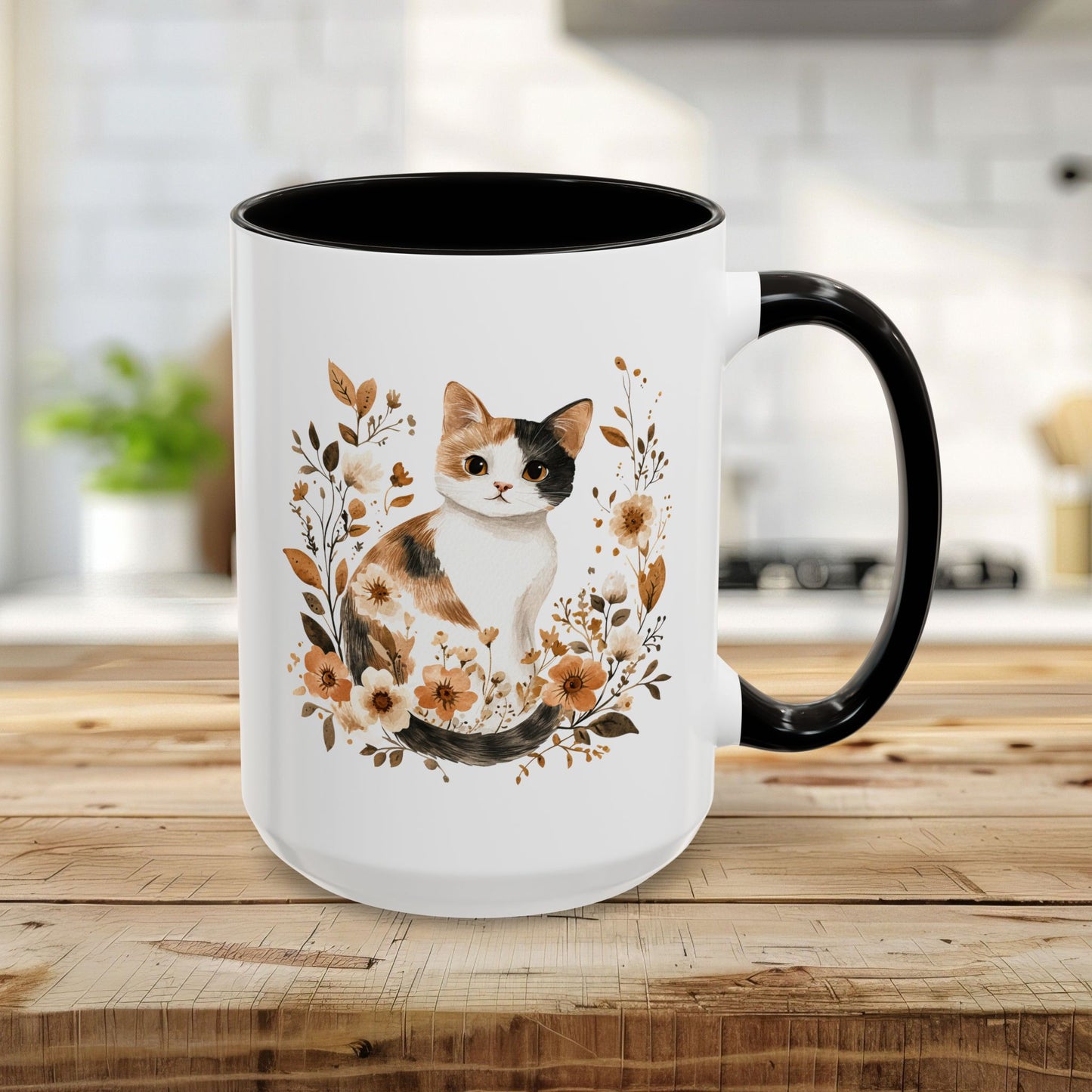 15oz white ceramic mug with watercolor calico cat and autumnal florals, black interior and handle.