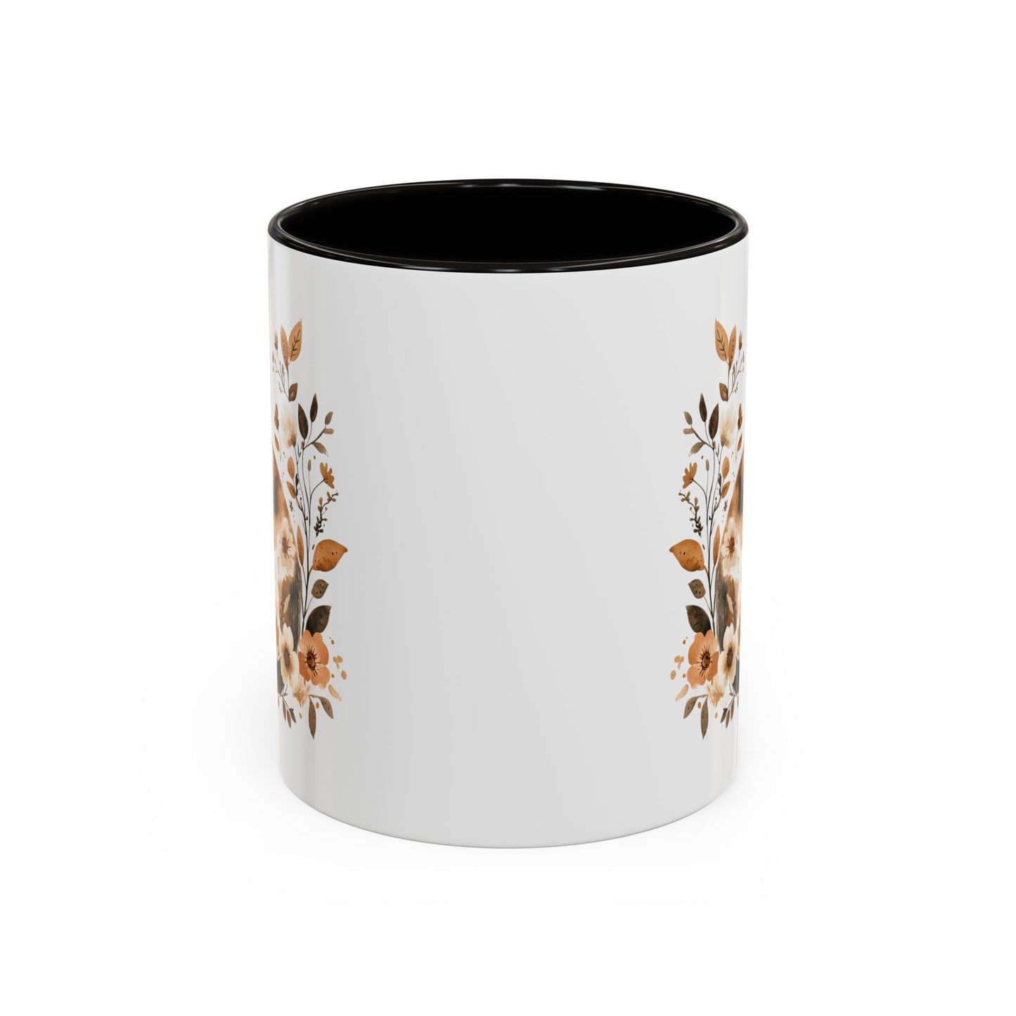 White ceramic mug with black interior and handle, featuring autumnal floral designs on the sides.