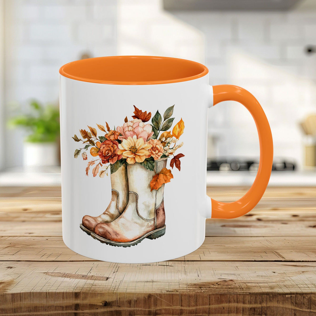 White ceramic 11oz mug with a golden yellow handle and interior, featuring watercolor cowboy boots overflowing with autumn flowers.