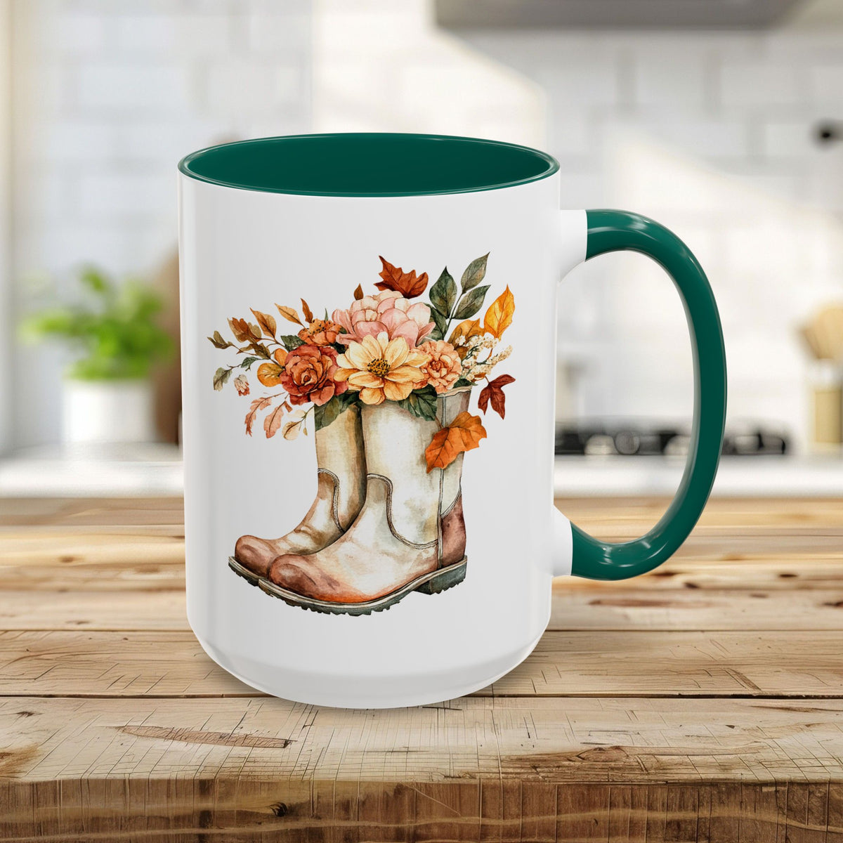 15oz white ceramic mug with green handle and interior, featuring watercolor cowboy boots overflowing with autumn flowers.