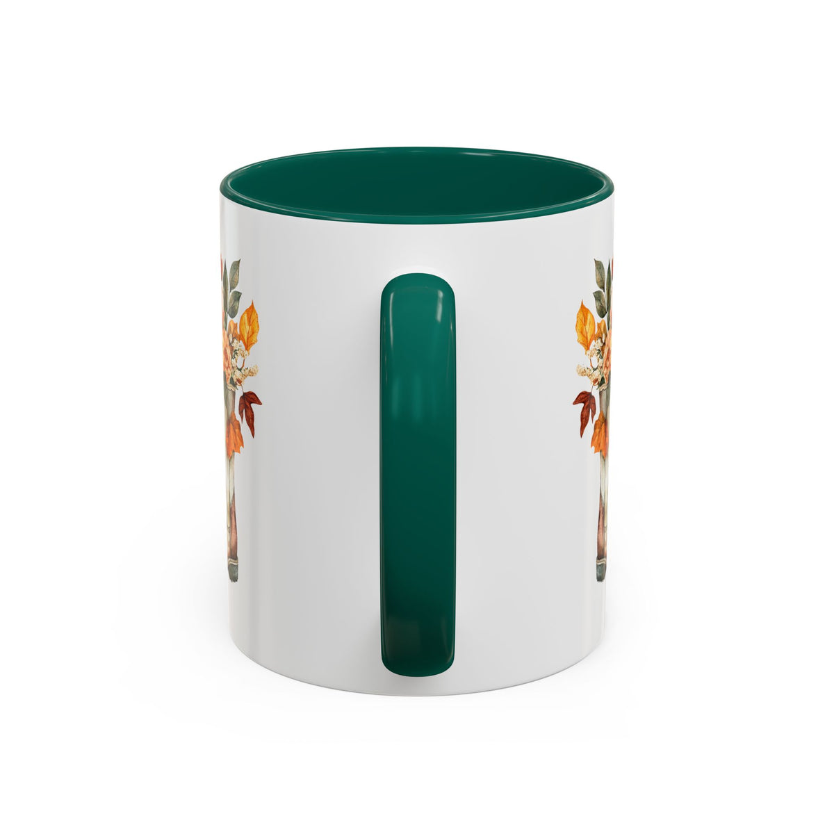White ceramic mug with a dark green handle and interior, featuring a watercolor autumn floral cowboy boots design.