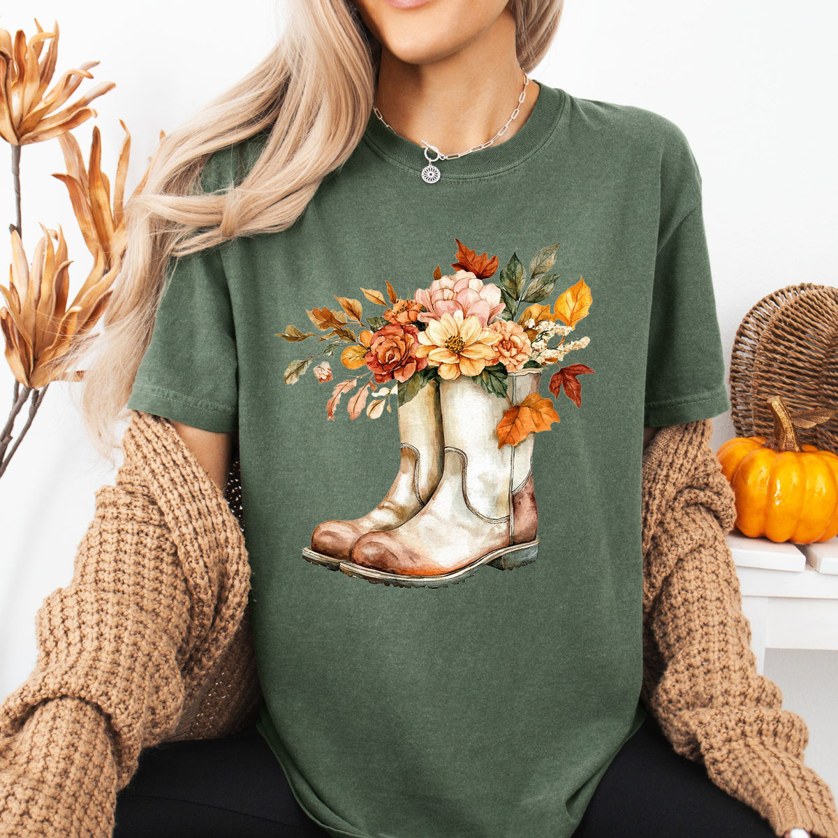 Relaxed-fit, garment-dyed green cotton tee with watercolor cowboy boots and autumn blooms.