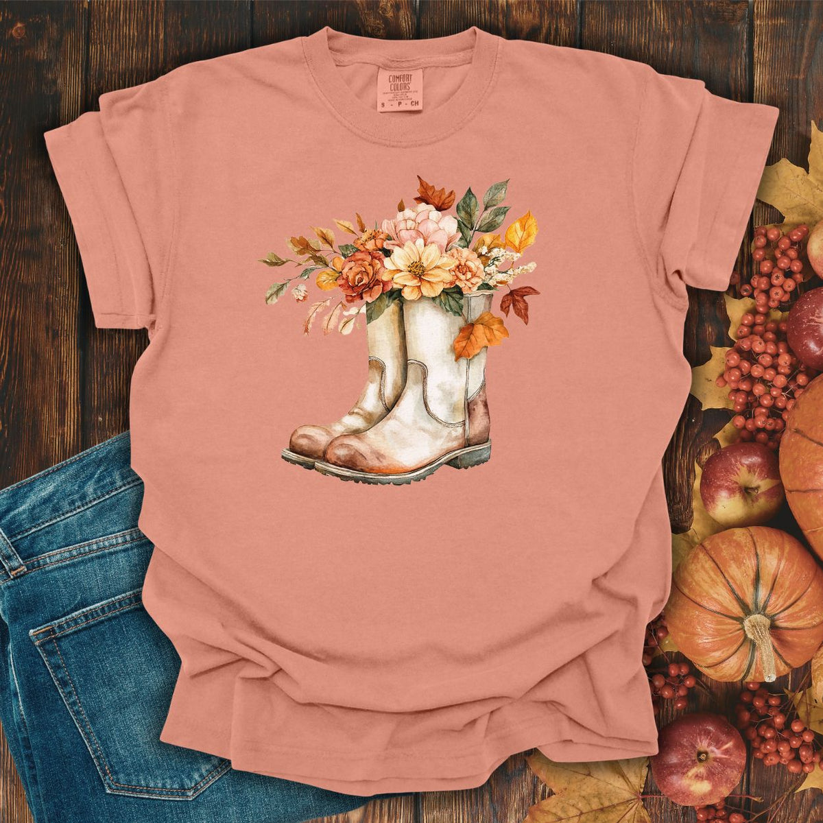 Terracotta relaxed-fit cotton tee with watercolor cowboy boots and autumn blooms.