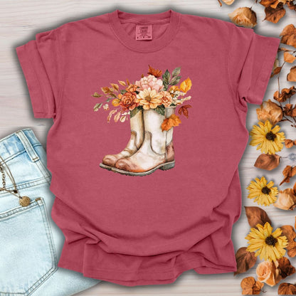 Crimson garment-dyed cotton t-shirt with watercolor cowboy boots and autumn flowers.