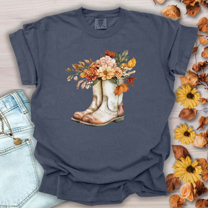 Denim blue cotton tee with watercolor cowboy boots overflowing with autumn flowers and leaves.