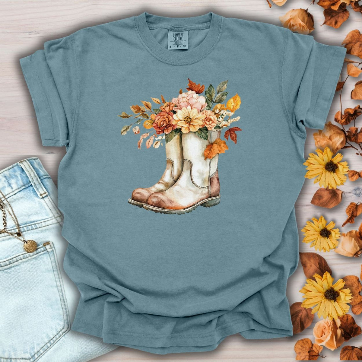 Ice Blue relaxed-fit cotton t-shirt with watercolor cowboy boots and autumn flowers.