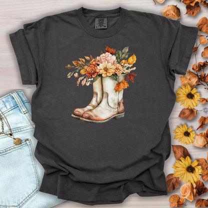 Pepper-colored cotton tee with watercolor cowboy boots brimming with autumn flowers and leaves.