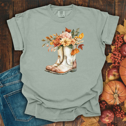 Bay-colored, relaxed-fit cotton t-shirt with watercolor cowboy boots and autumn blooms.