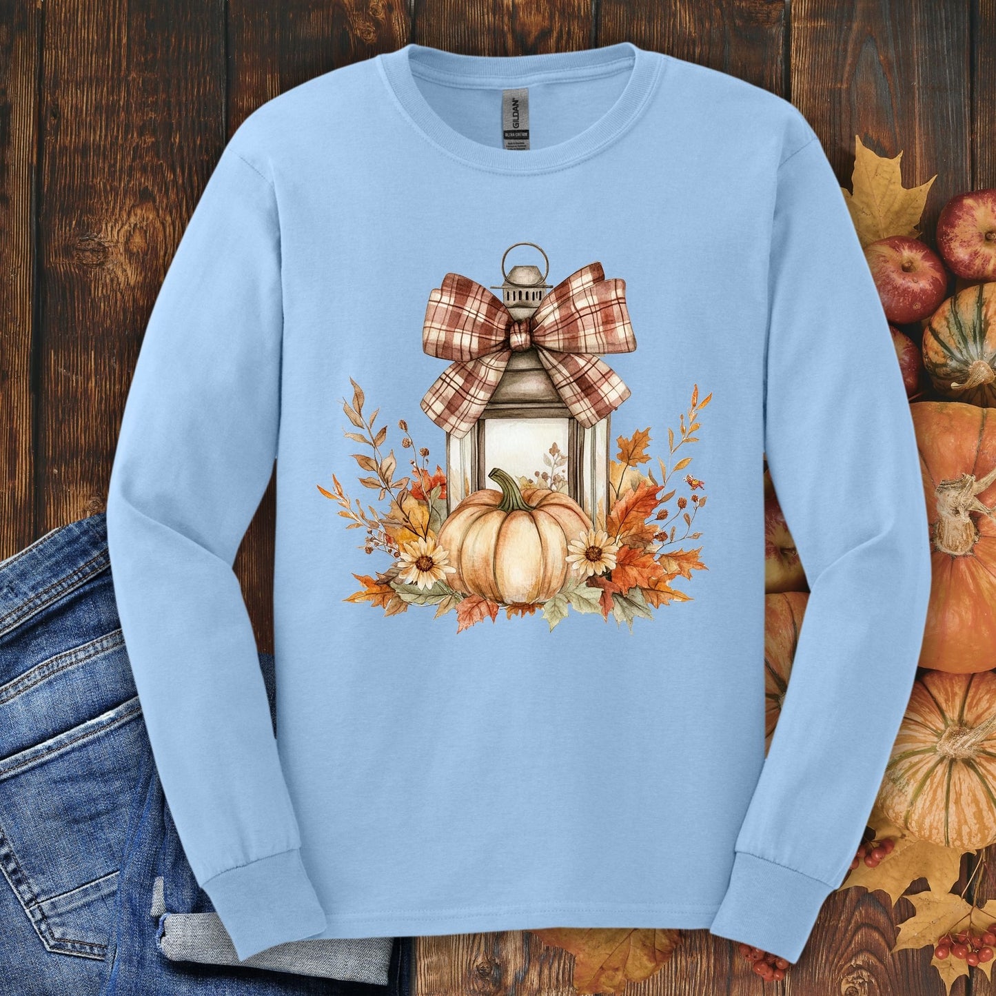 Light blue long sleeve tee with watercolor autumn lantern, pumpkin, and fall florals.