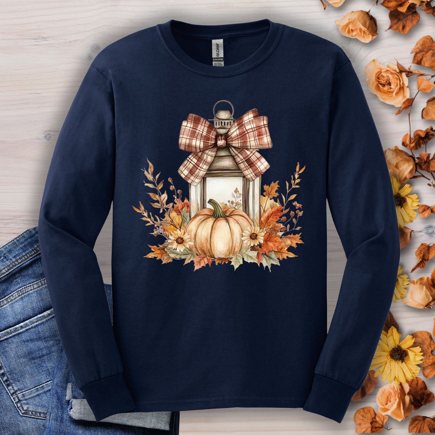 Navy long sleeve tee with watercolor autumn lantern, plaid bow, pumpkin, and fall florals.
