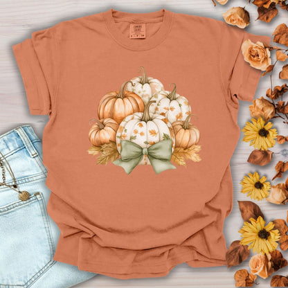 Yam Comfort Colors tee with watercolor pumpkins, fall leaves, and a sage green bow.