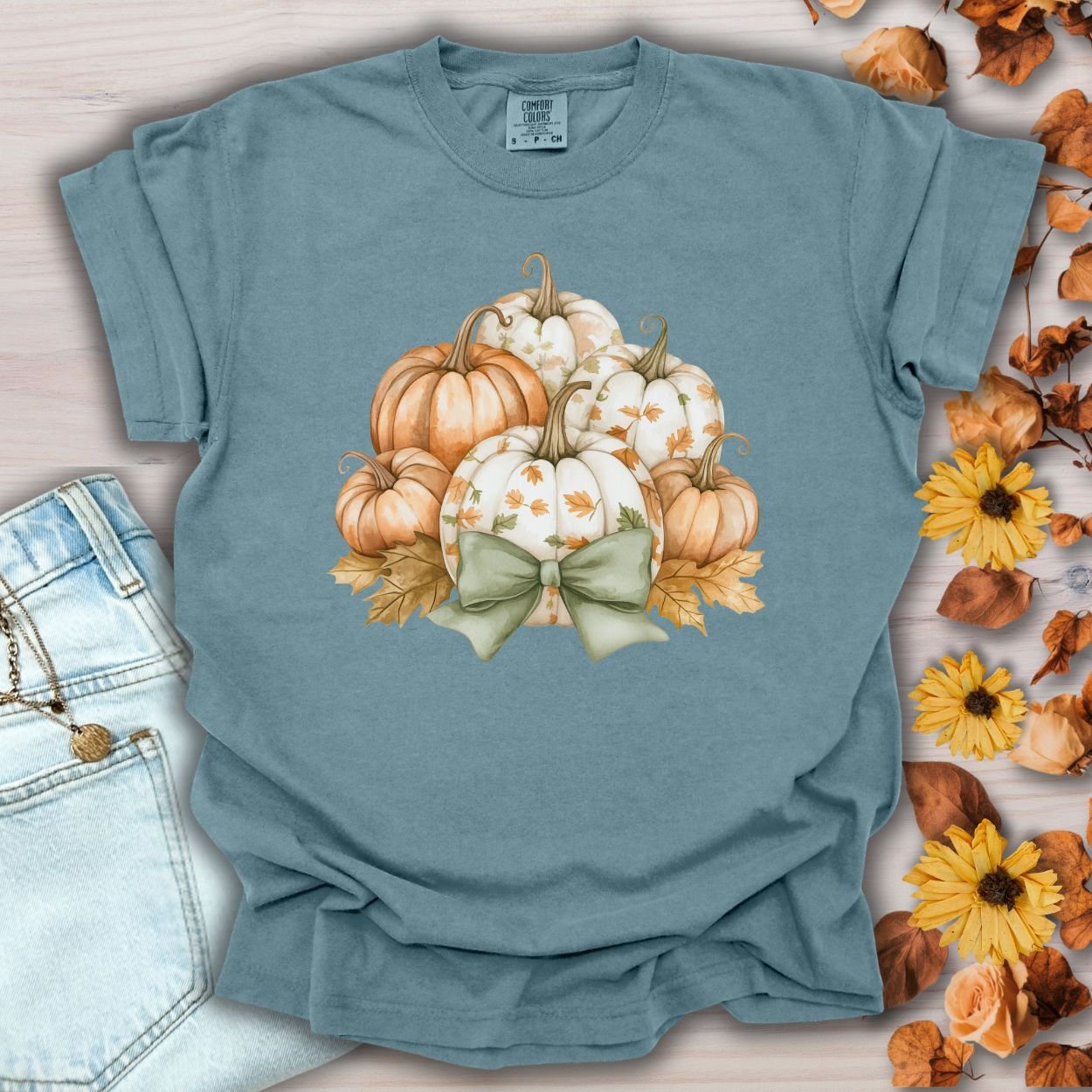 Ice Blue Comfort Colors tee with watercolor pumpkins, fall leaves, and a sage green bow.