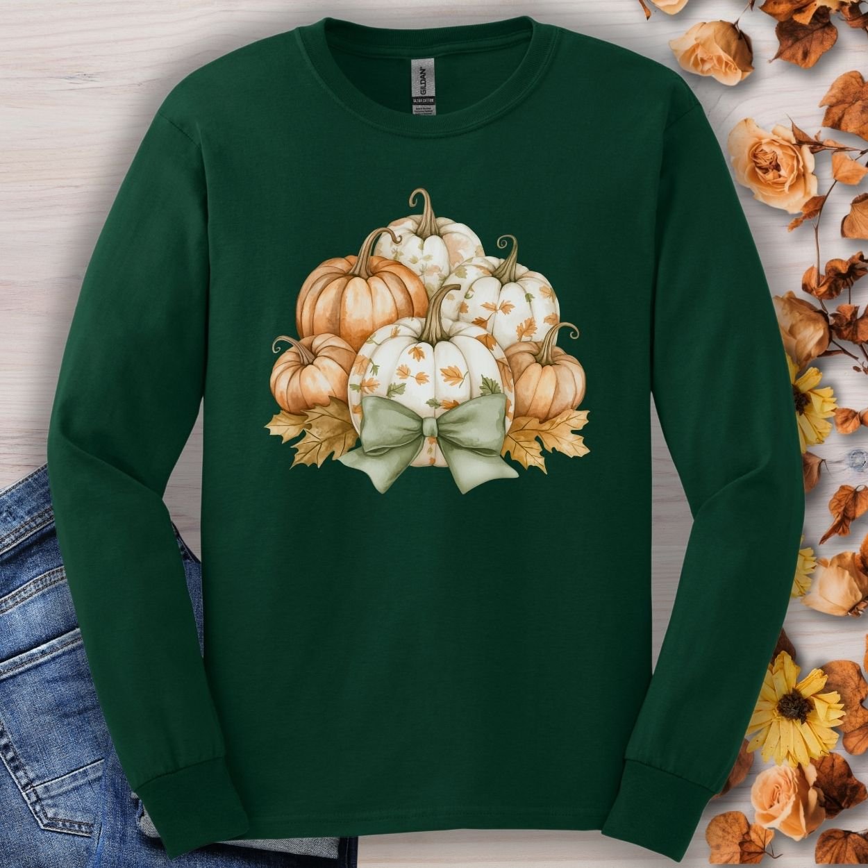 Forest Green long sleeve tee with watercolor terracotta and cream pumpkins, sage bow, and autumn leaves.