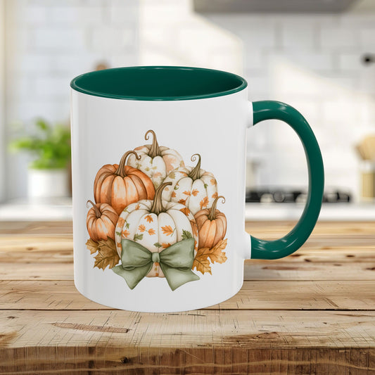White 11oz ceramic mug with green interior and handle, featuring a watercolor pumpkin and foliage design.