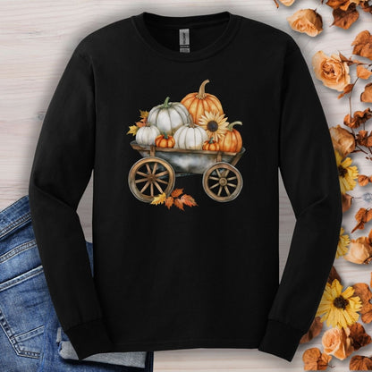 Black long sleeve tee with a watercolor wagon full of white and orange pumpkins and fall leaves.