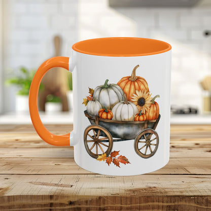 White ceramic 11oz mug with golden yellow interior and handle, featuring a watercolor pumpkin wagon design.