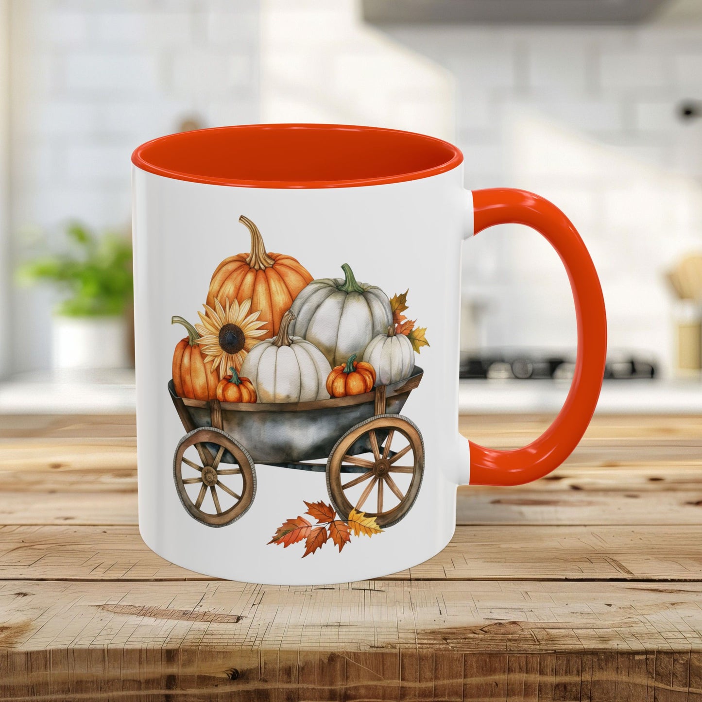 11oz ceramic mug with an orange rim and handle, featuring a watercolor print of pumpkins in a rustic wagon.