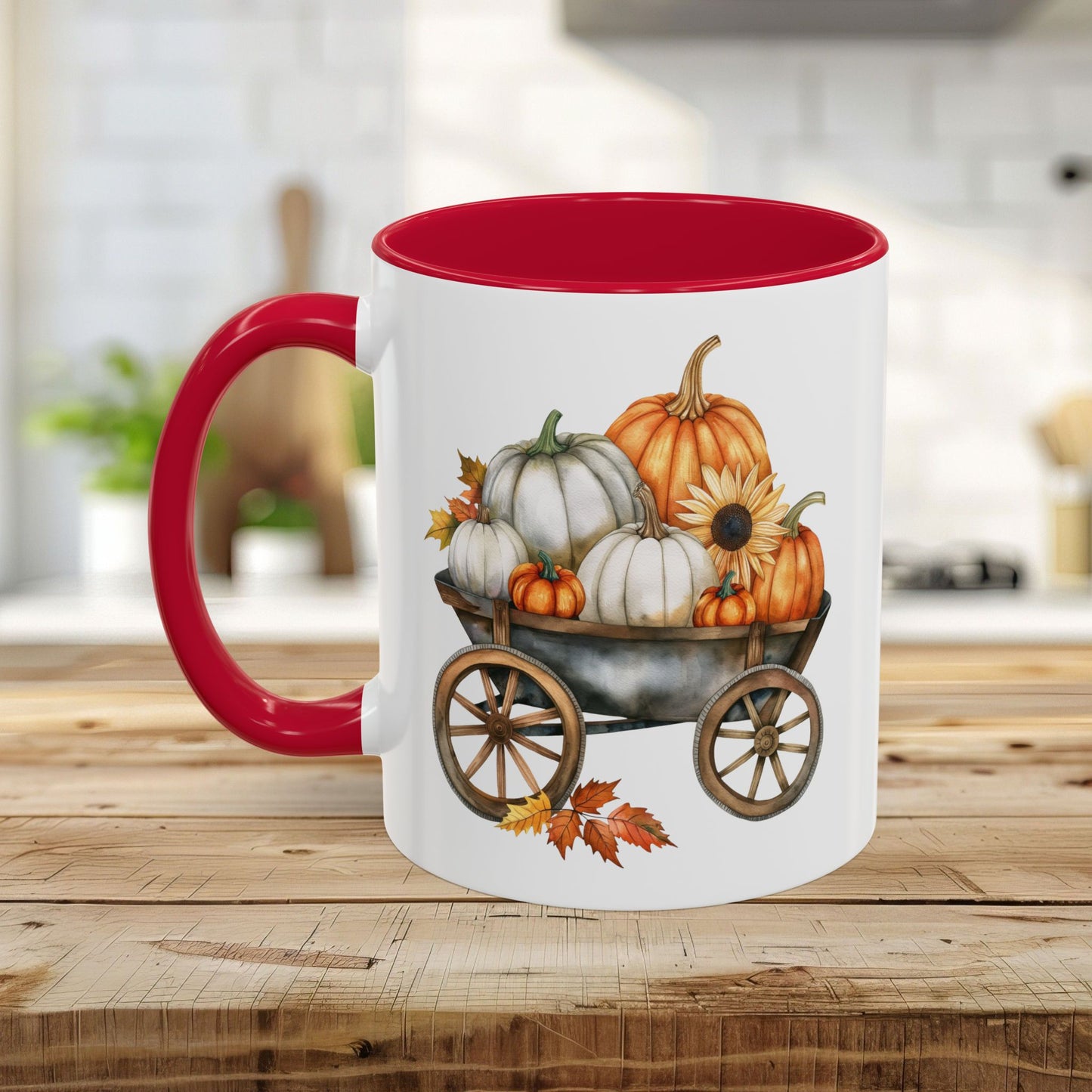 White ceramic mug with a red handle and interior, featuring a watercolor-style autumn wagon filled with pumpkins.