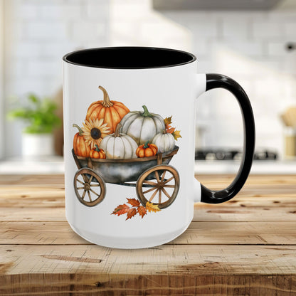 15oz ceramic mug with a black rim and handle, featuring a watercolor-style autumn pumpkin harvest wagon design.