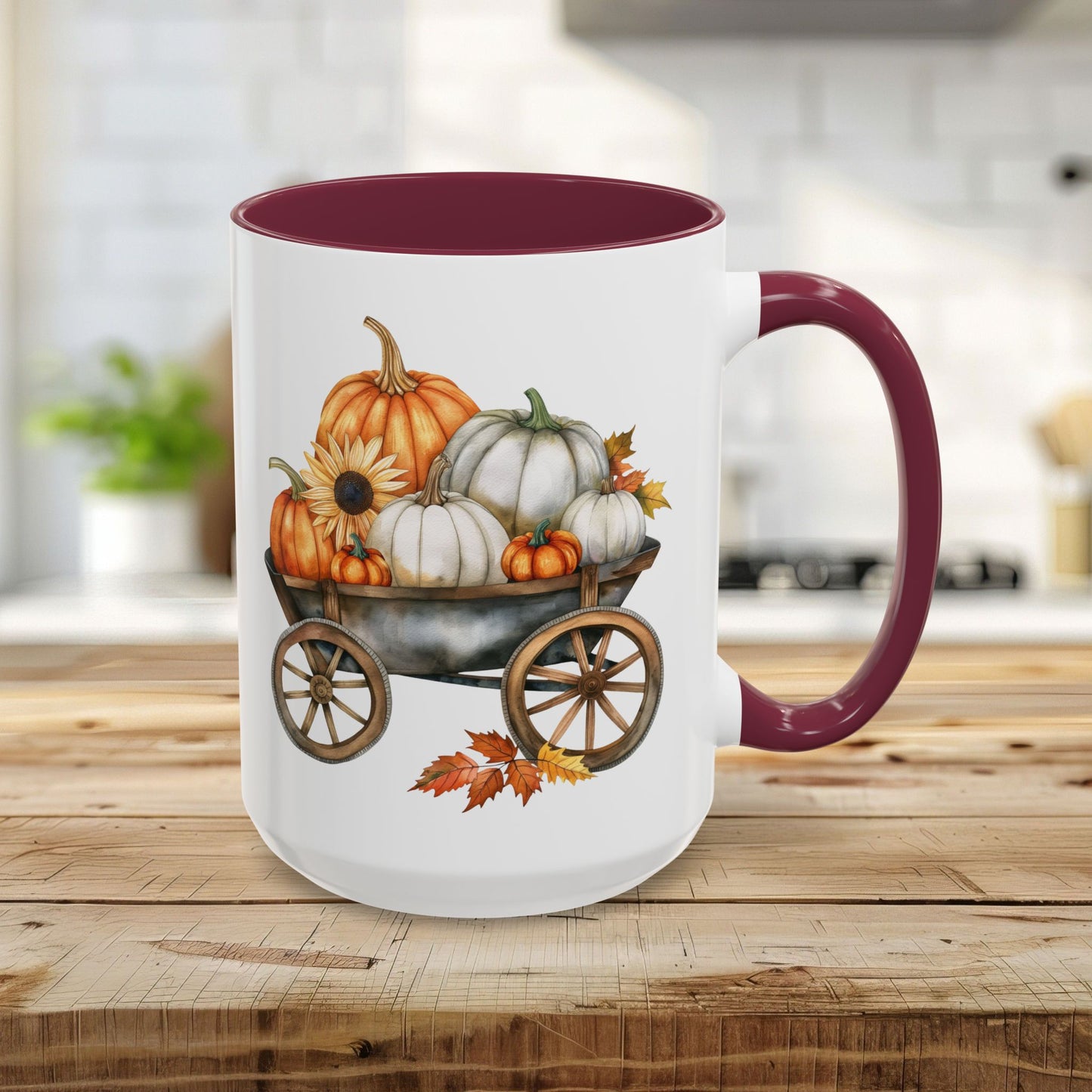 White 15oz ceramic mug with maroon rim and handle, featuring a watercolor print of pumpkins in a rustic wagon.