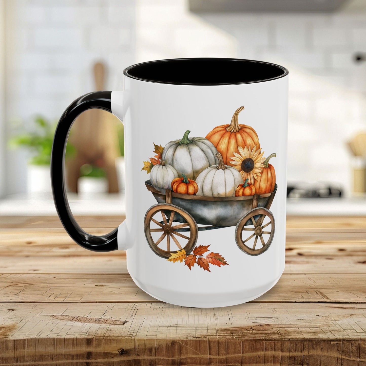 White ceramic mug with black rim and handle, featuring a watercolor design of pumpkins and a sunflower in a rustic wagon.
