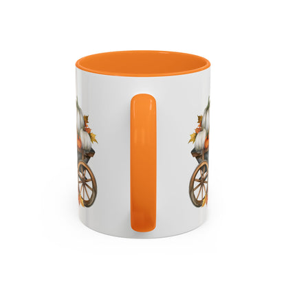White ceramic mug with an orange interior and handle, featuring a watercolor-style autumn pumpkin harvest wagon design.