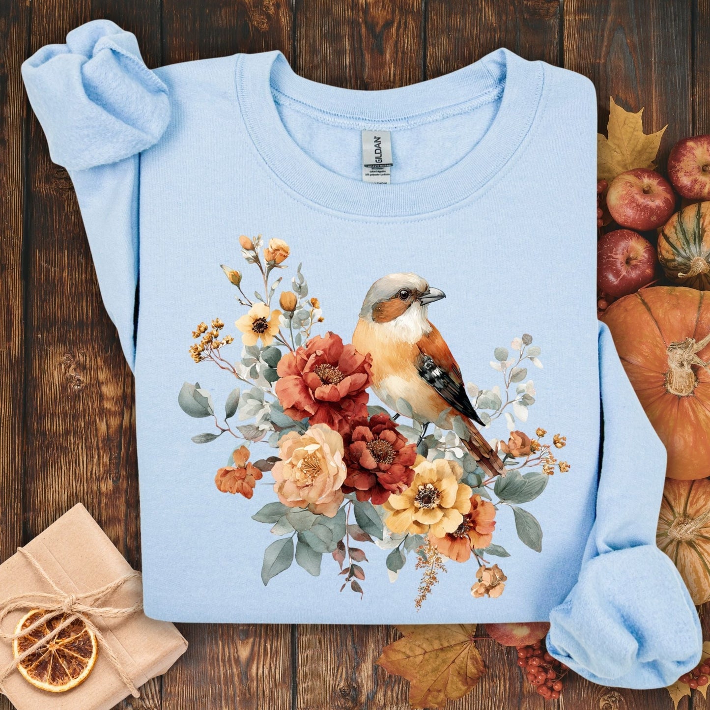 Light blue Gildan sweatshirt with a watercolor sparrow and autumn roses design, size S.