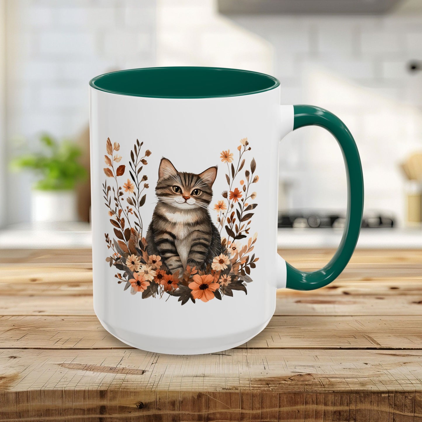15oz glossy ceramic mug with a tabby cat, autumn wildflowers, and a green interior/handle.