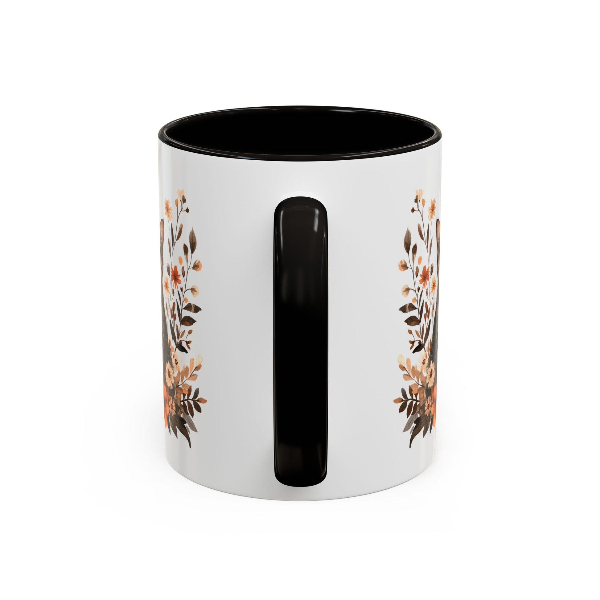 White ceramic mug with black handle and interior, featuring a watercolor autumn floral design.