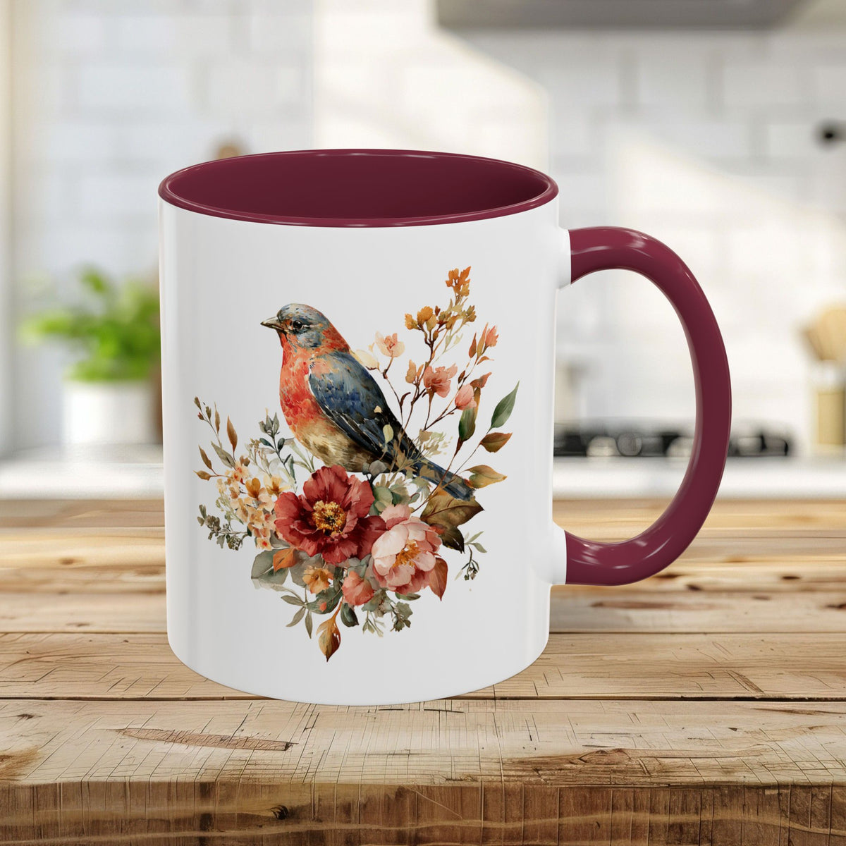 11oz ceramic mug with a maroon interior/handle and a watercolor bluebird & peony design.