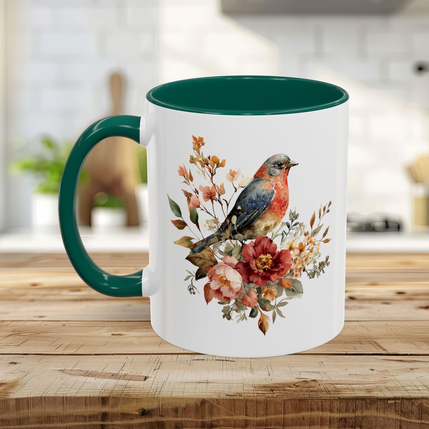 White ceramic mug with a green interior and handle, featuring a watercolor bluebird and peony design.