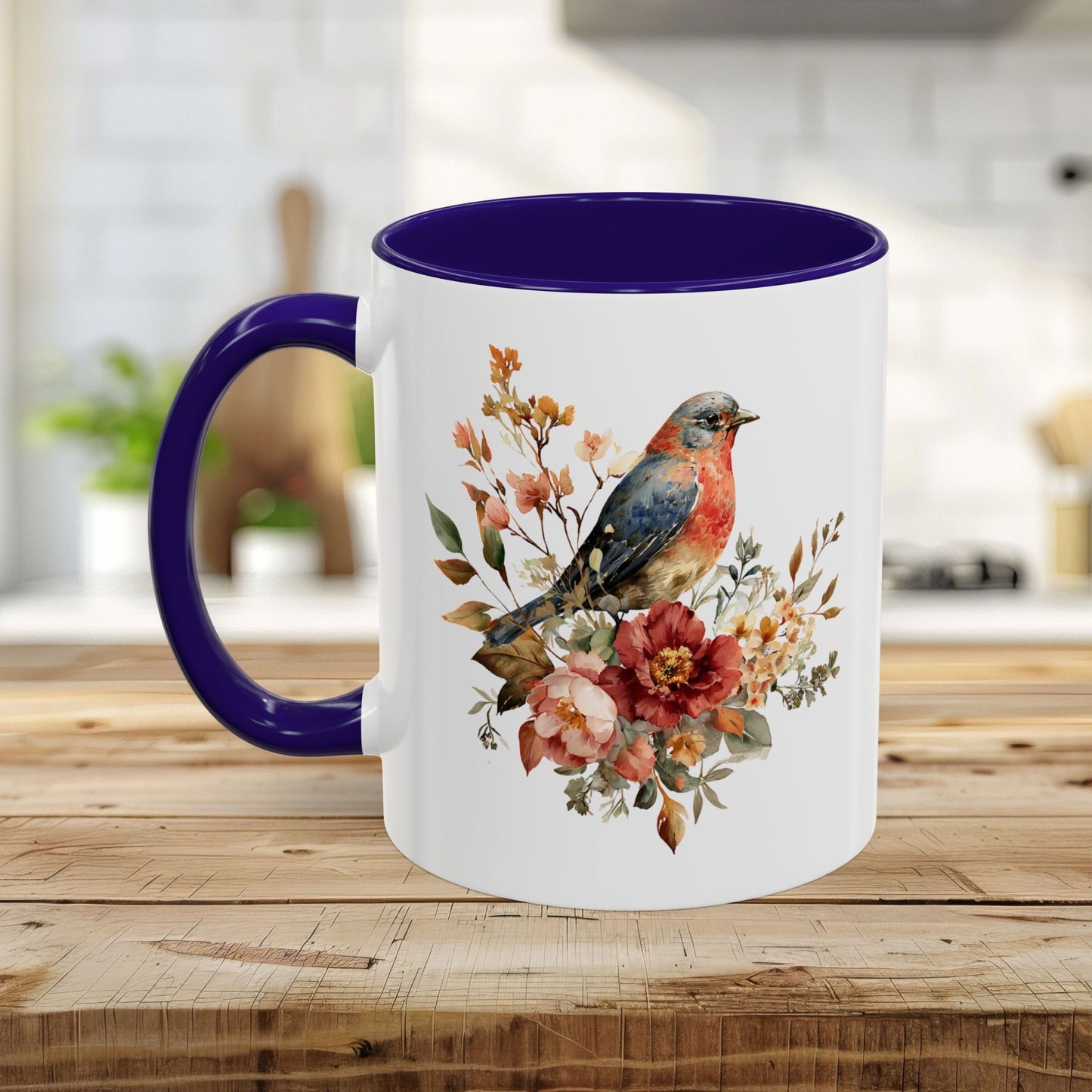 White ceramic mug with a bluebird and peony watercolor print, purple interior and C-shaped handle.