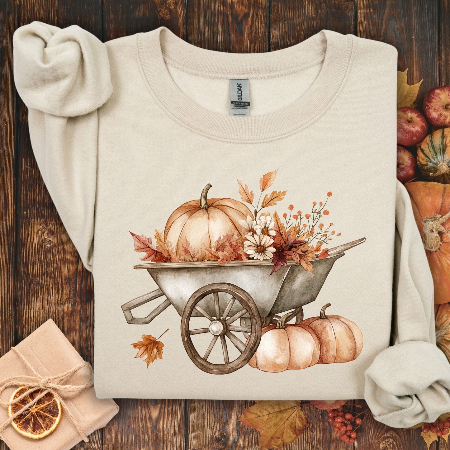 Sand Gildan sweatshirt with a boho wagon, pumpkins, and autumn flowers design.