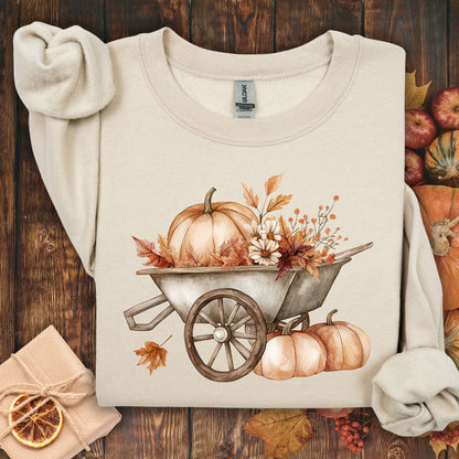 Sand Gildan sweatshirt with a boho wagon, pumpkins, and autumn flowers design.