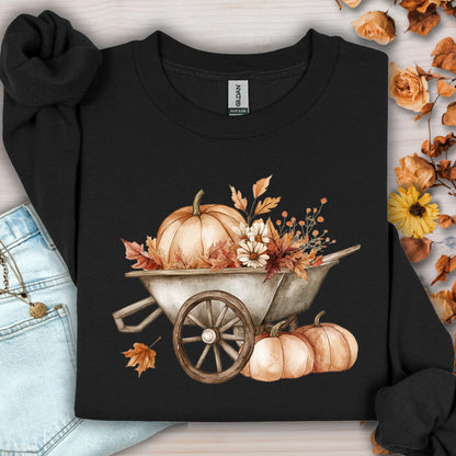 Black Gildan sweatshirt with a boho wagon, pumpkins, and autumn flowers in muted tones.