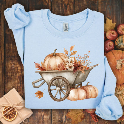 Light blue Gildan sweatshirt with a boho wagon, pumpkins, and autumn flowers.